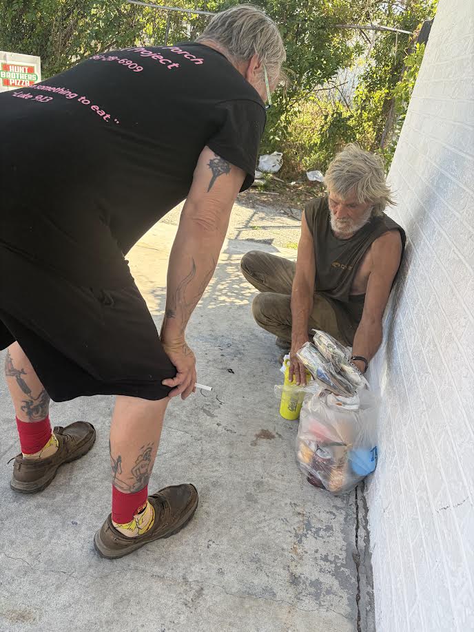 Volunteer serving community member